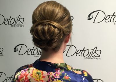 back view of a wedding bun and women's haircut created at Details Salon & Spa in Mount Joy, PA
