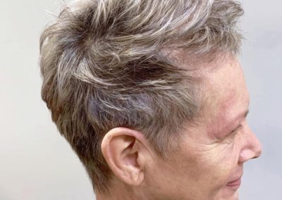 Side view of short woman's haircut