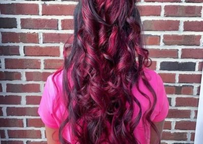 Long curly red dyed hair